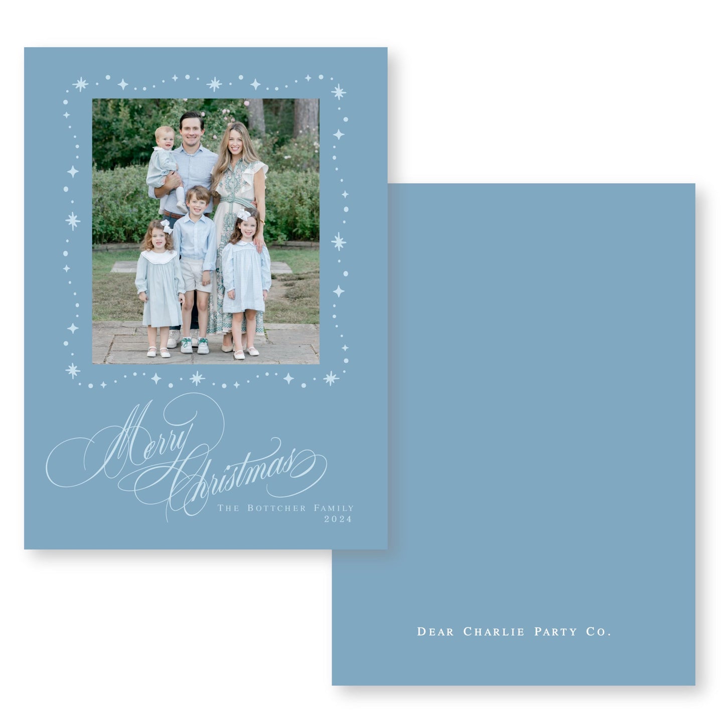 A family photo of a man, woman, and two children dressed in light blue clothing, posing together in a garden setting. The text "Merry Christmas" is written in a decorative font at the bottom of the image, and "The Botcher Family" is written above it. The text "Dear Charlie Party Co." is also present, indicating the source or organization responsible for the photo.