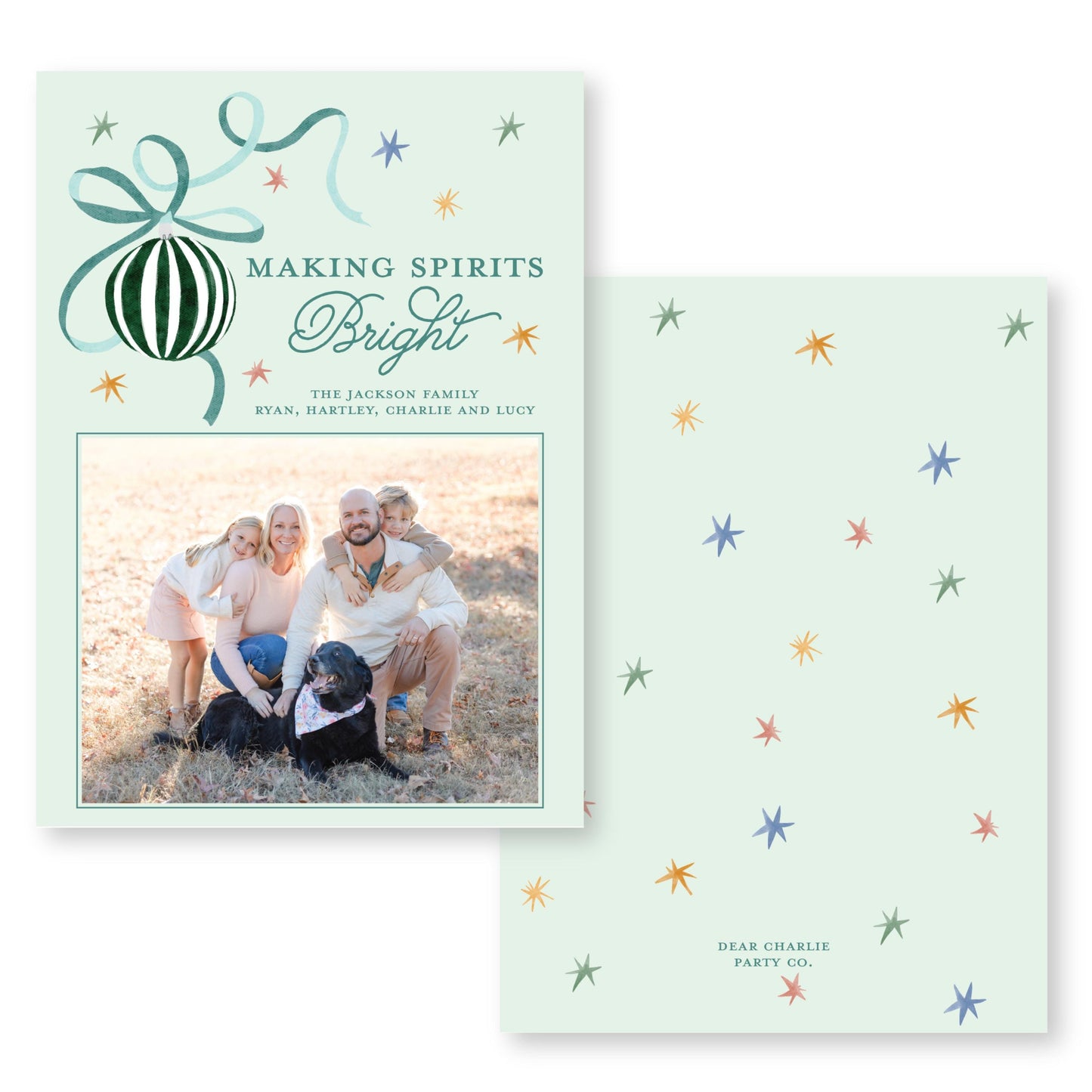 The image is a holiday card featuring a family photo and decorative elements such as stars and a ribbon.