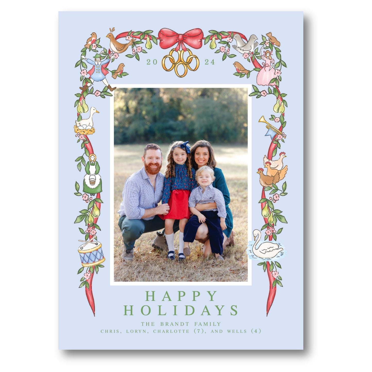 a happy holiday card with a picture of a family