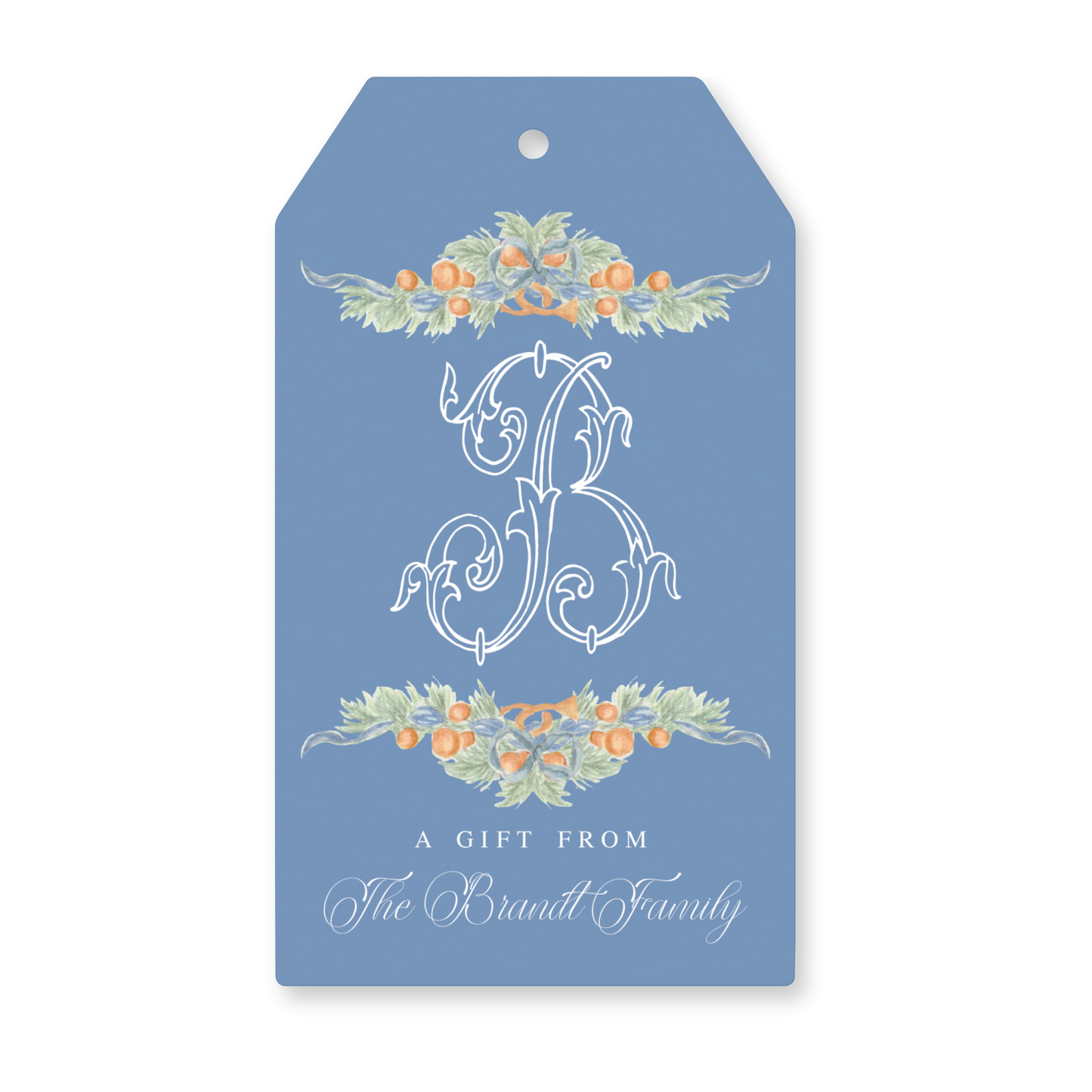 a blue gift tag with a floral monogrammed design