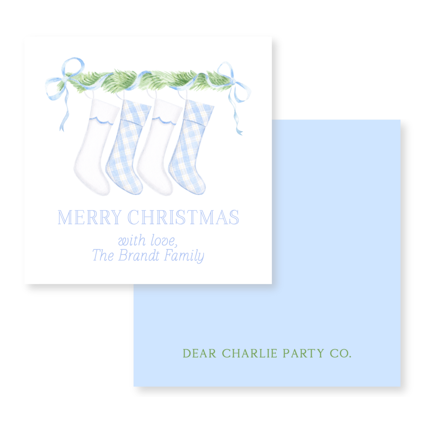 a blue and white christmas card with three stockings