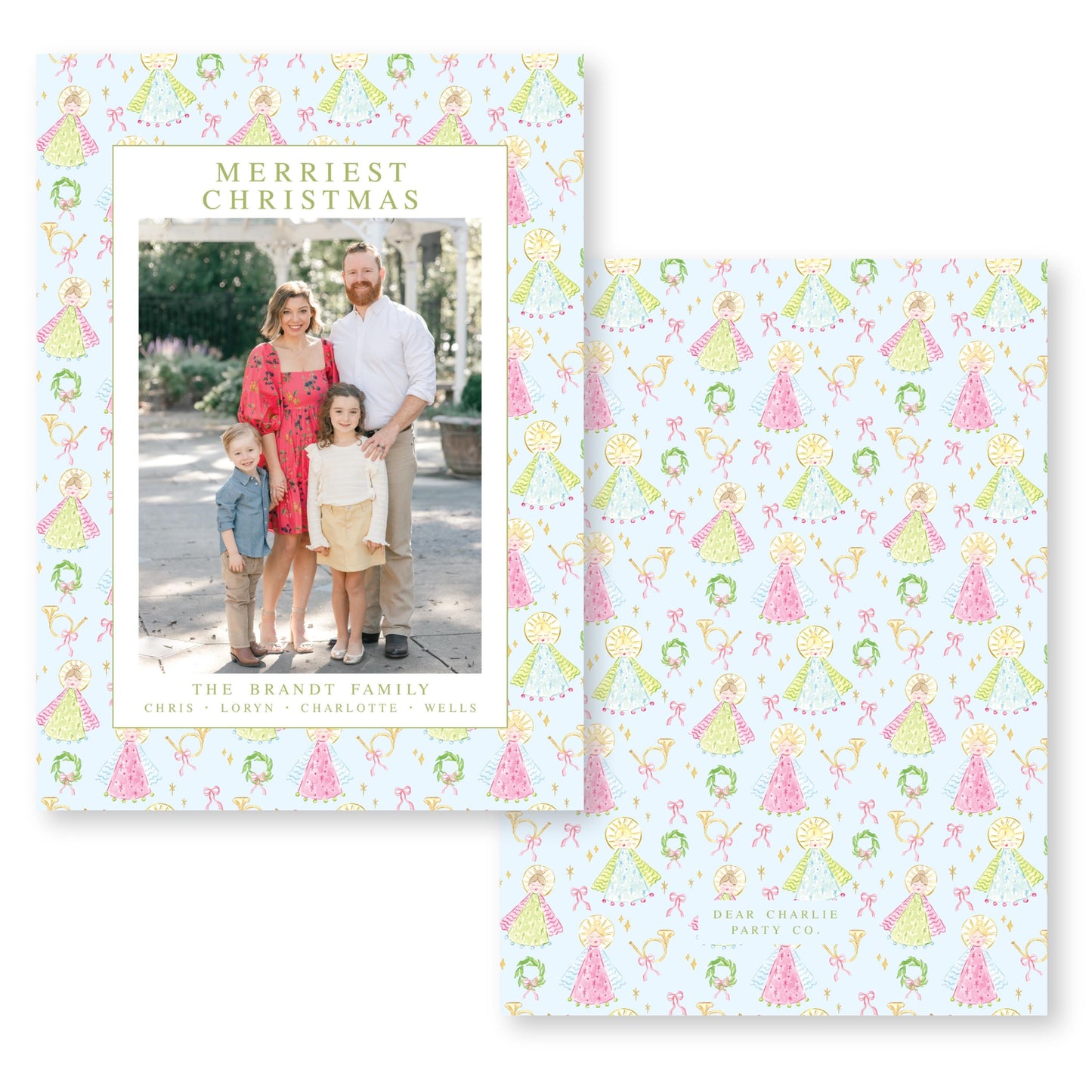 A family portrait of a couple and their two children, with a pattern of Christmas trees and angels on the background.
