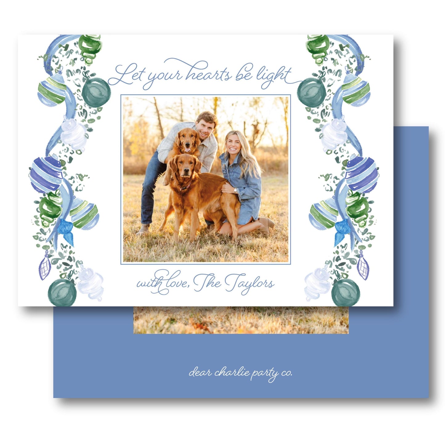 a card with a picture of a couple and their dog