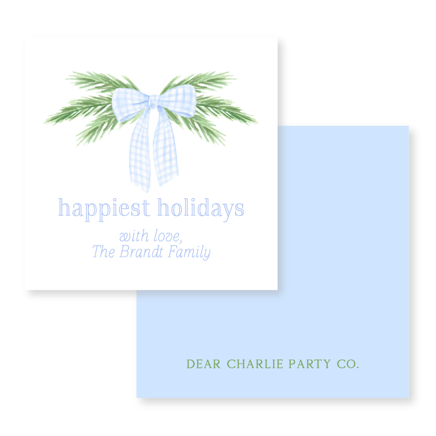 a blue and white holiday card with a bow