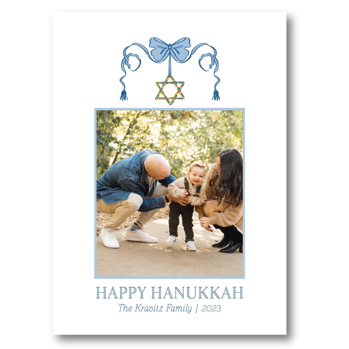a happy hanukkah card with a photo of a man and a woman