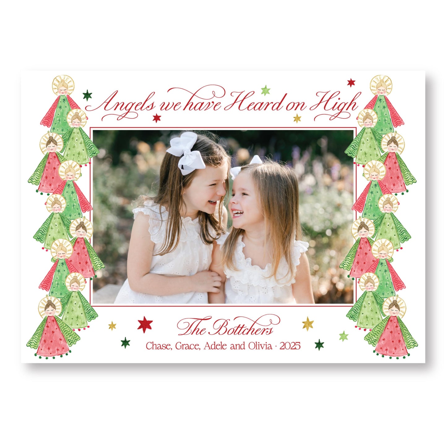 two young girls smiling and posing together in a festive frame with Christmas trees and stars.