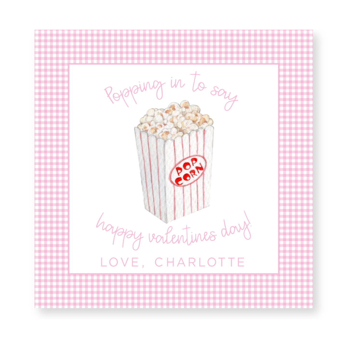 a pink and white checkered card with a popcorn box