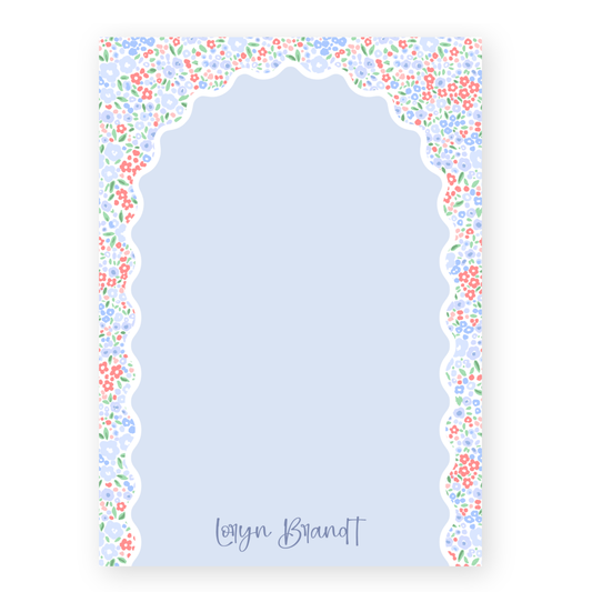 a blue card with a border of flowers