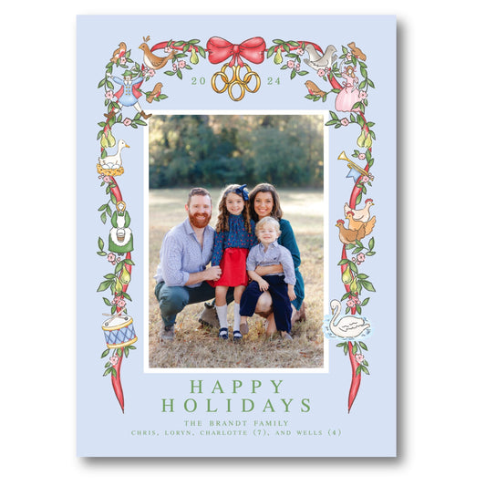 a happy holiday card with a picture of a family