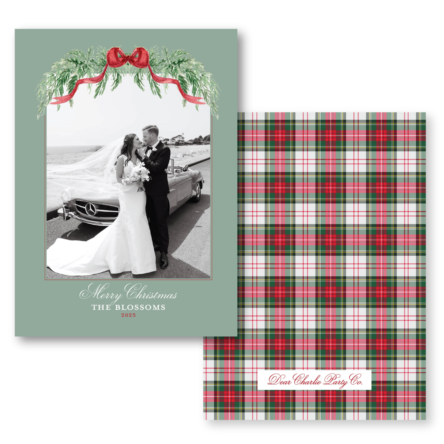 The image is a wedding card featuring a bride and groom standing together in front of a car, with a festive wreath above them. The card has a green background and a red ribbon.