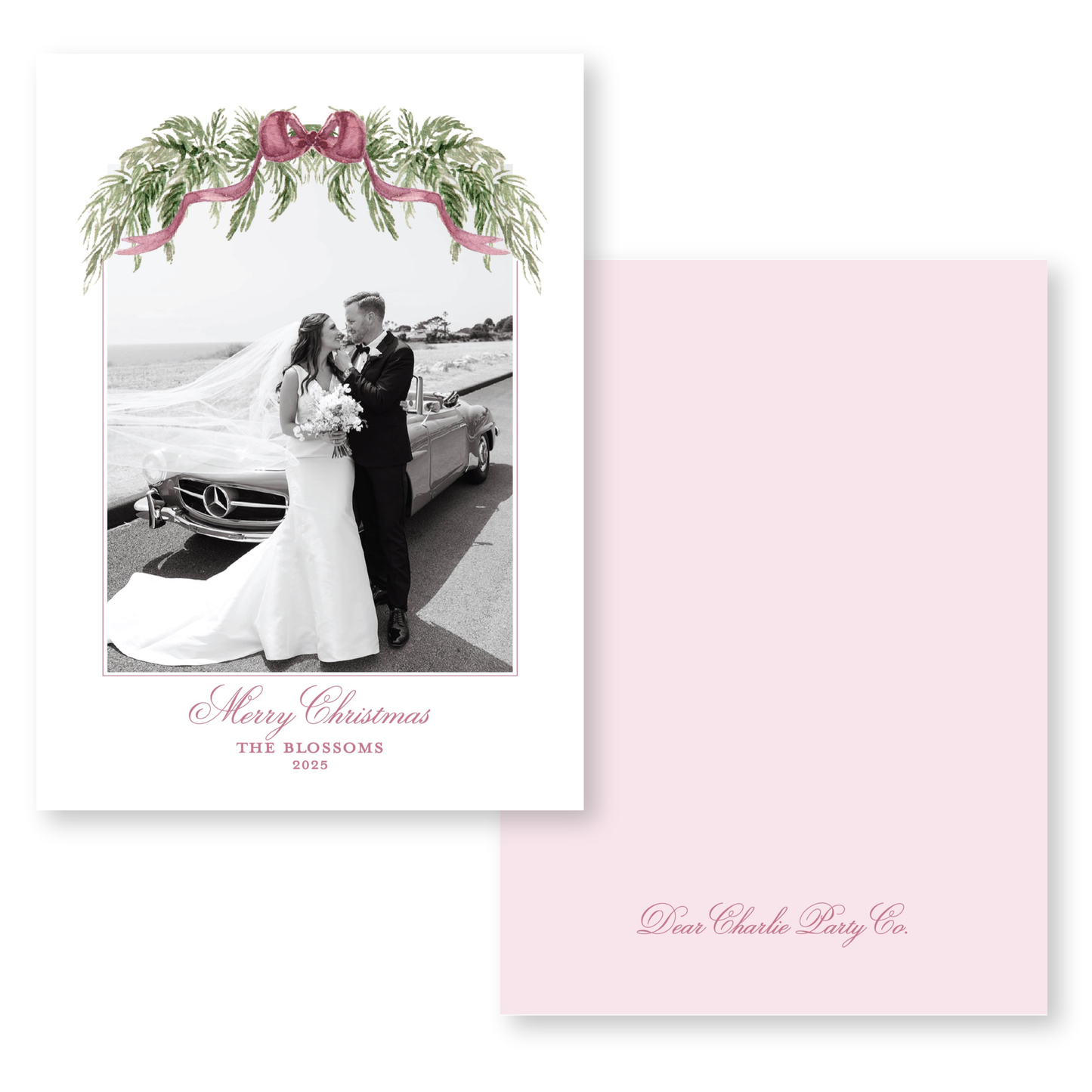 A black and white photograph of a bride and groom standing next to a car, with a pink ribbon and greenery decoration above them. The text below the image reads "Merry Christmas THE BLOSSOMS 2015".