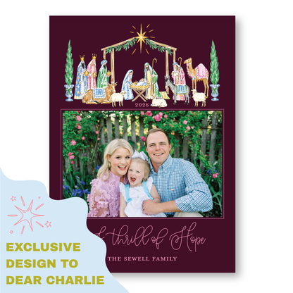 A family portrait of a man, woman, and child, with a nativity scene and a star above them, set against a backdrop of greenery.