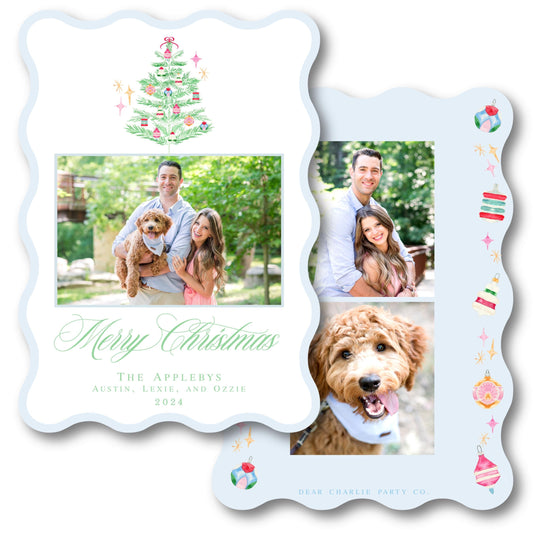 a christmas card with a family picture and a christmas tree