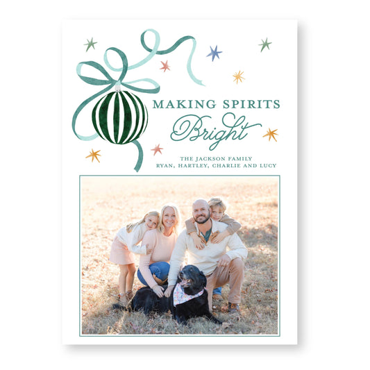 A family portrait of a man, woman, and two children posing together outdoors, with a dog in the foreground. The text above the image reads &quot;MAKING SPIRITS BRIGHT&quot; and below the image, it says &quot;THE JACKSON FAMILY Ryan, Hartley, Charlie and Lucy&quot;.