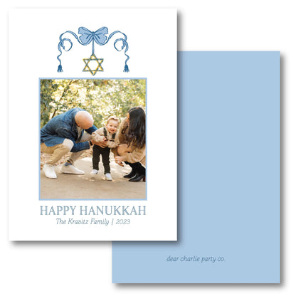 a happy hanukkah card with a picture of a family