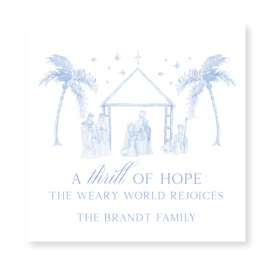 a christmas card with a nativity scene and palm trees