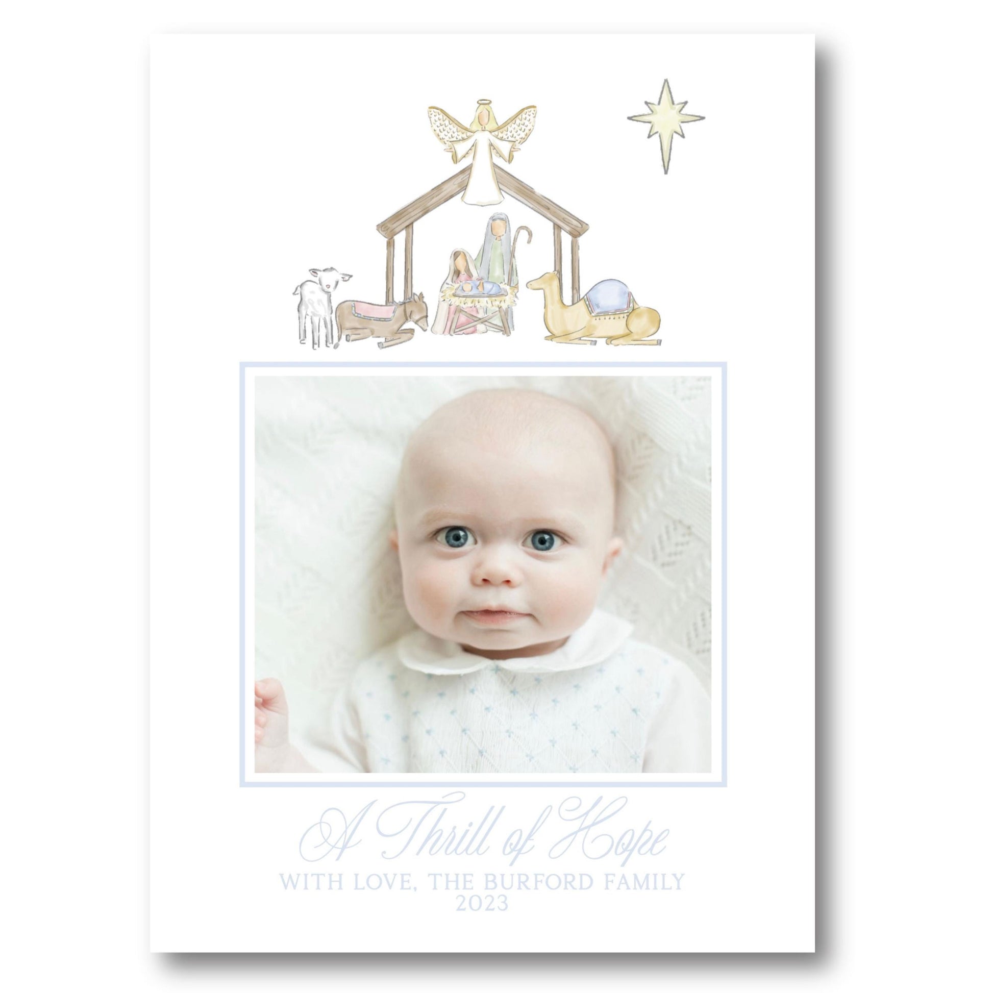 a christmas card with a picture of a baby in a nativity scene