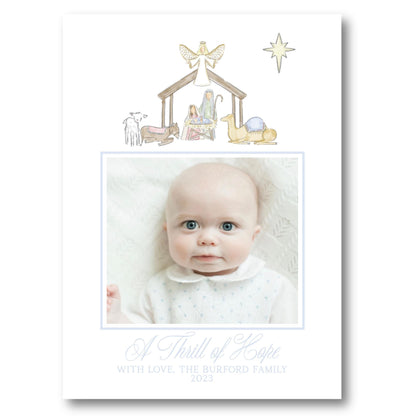 a christmas card with a picture of a baby in a nativity scene