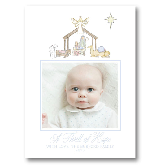a christmas card with a picture of a baby in a nativity scene