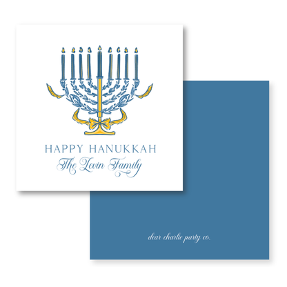 a hanukkah card with a menorah on it