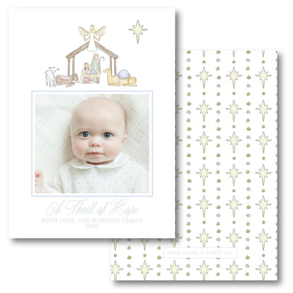 a christmas card with a picture of a baby in a nativity scene