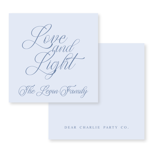 a couple of cards with the words love and light on them