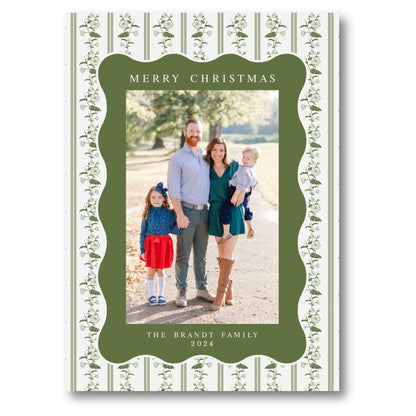 a family christmas card with a green border