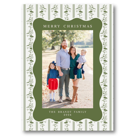 a family christmas card with a green border