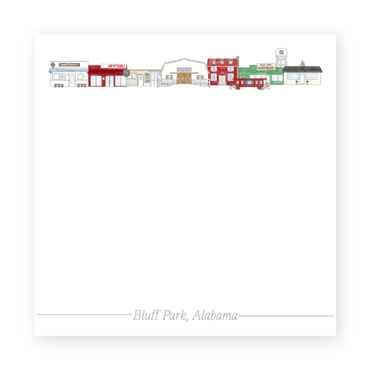 a white paper with a red and green building
