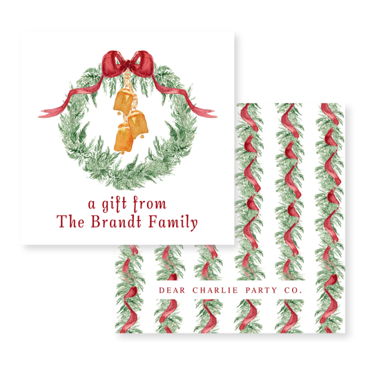 a christmas card with a wreath and bells on it