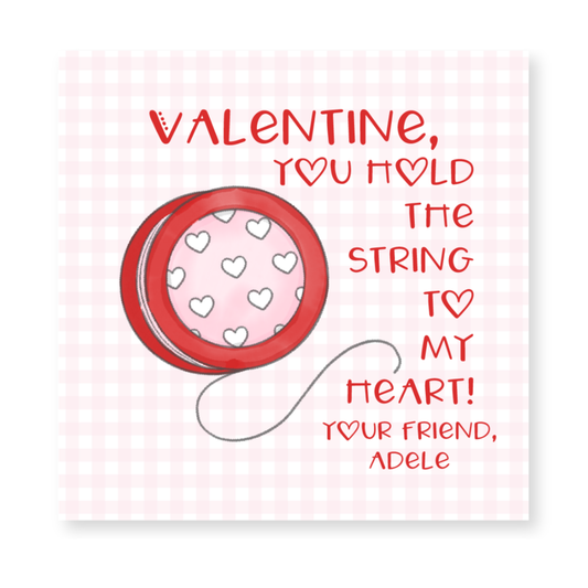 a valentine card with a ball of thread and hearts