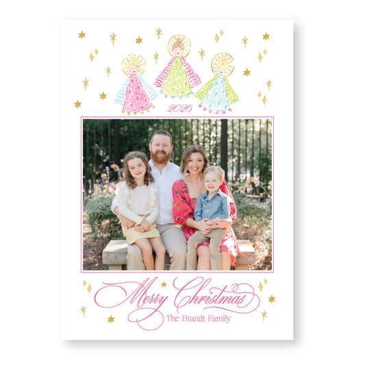 A family portrait of a couple and their three children, taken outdoors in a park setting. The family is seated together, with the parents and two children posing for the photo. The image is framed with a border and contains a "Merry Christmas" greeting at the bottom, along with the text "The Brandt Family".