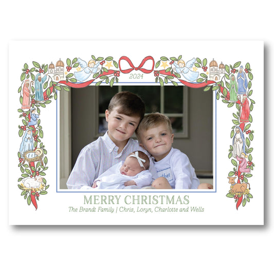 a christmas card with a picture of two boys holding a baby