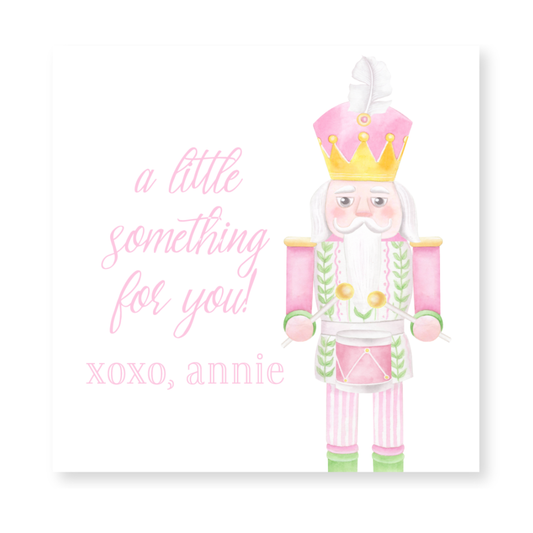 a card with a picture of a nutcracker wearing a crown
