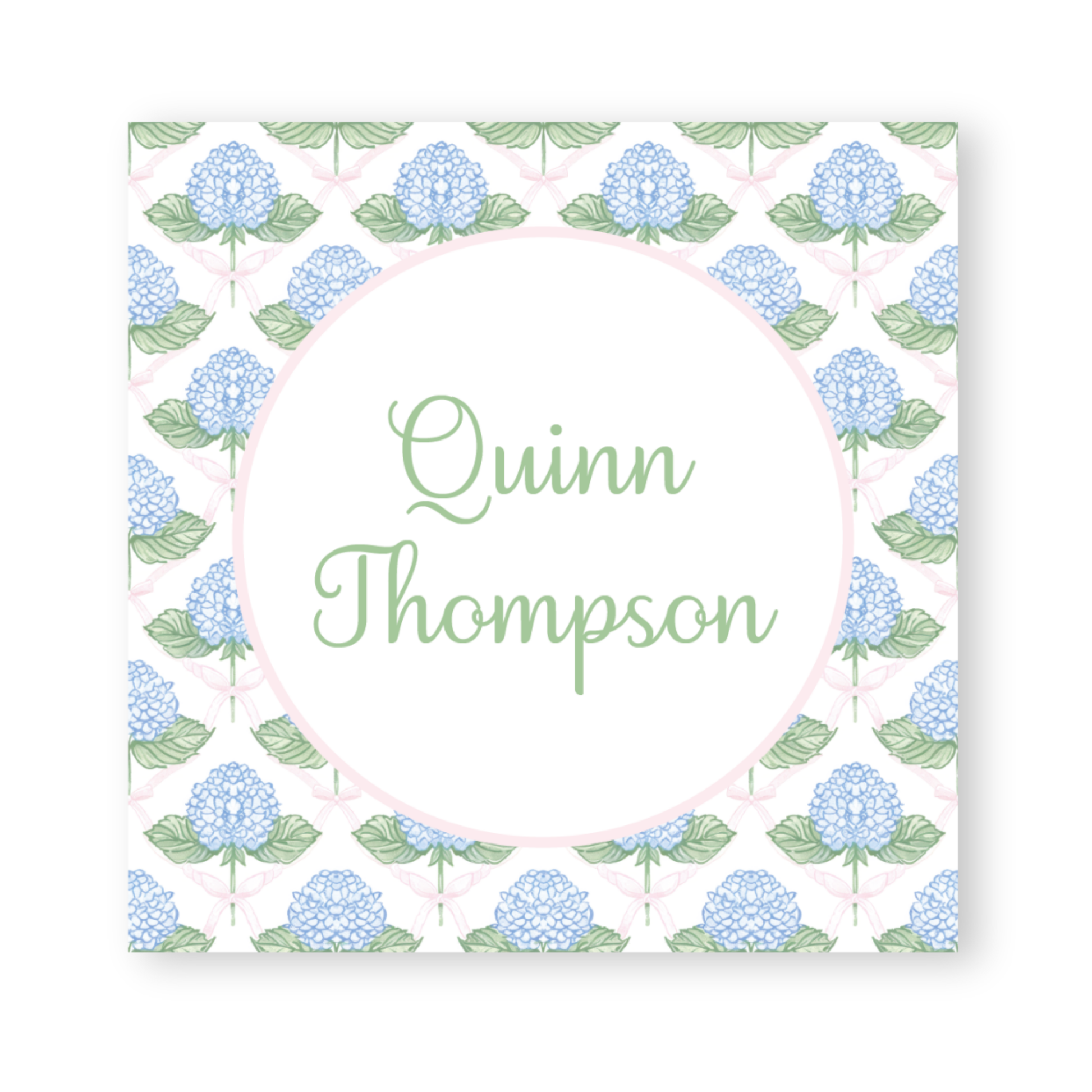 a card with blue flowers and green leaves