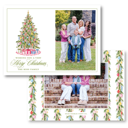 The image is a collage of two photos featuring a family posing for a Christmas picture. The family consists of a man, a woman, and two children. The collage includes a Christmas tree with presents and a family photo on the right side. The text on the collage wishes the viewer a very Merry Christmas and mentions the Ross family.