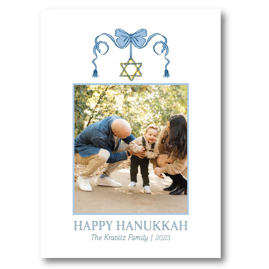 a happy hanukkah card with a photo of a man and a woman
