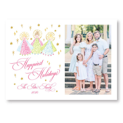 A family portrait of a group of people, including adults and children, posing together on a staircase. The text "Happiest Holidays" is written above the portrait, and "The Peters Family" is written below it.