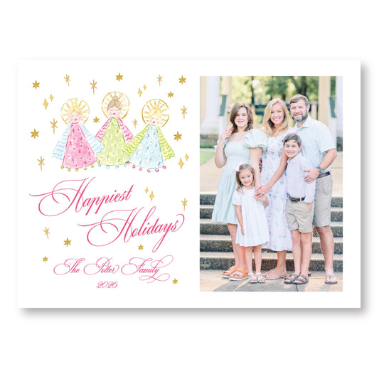 A family portrait of a group of people, including adults and children, posing together on a staircase. The text "Happiest Holidays" is written above the portrait, and "The Peters Family" is written below it.