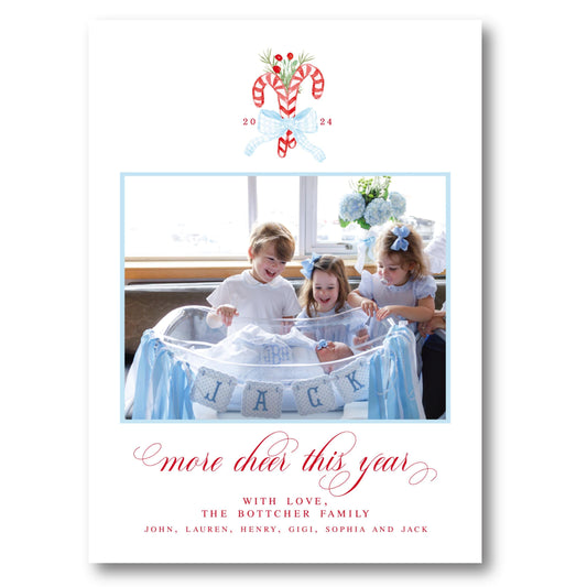 a christmas card with a picture of three children in a bathtub